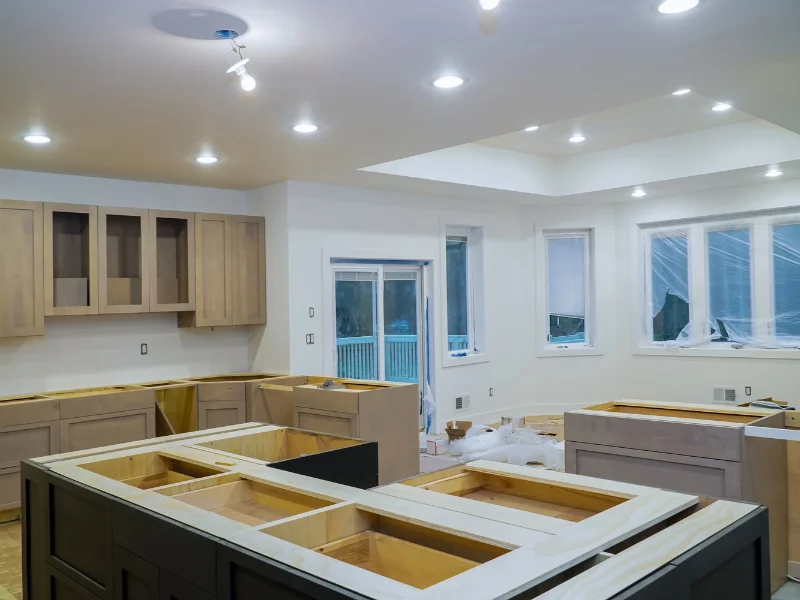 A kitchen under renovation with newly installed pot lights and recessed ceiling fixtures, completed by our Waterdown electricians.